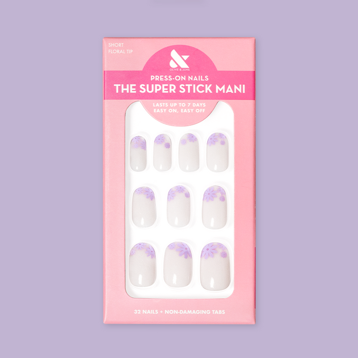 Floral Tip | Short | Round - Tab Press-On nails with neutral base and lavender flower tips in retail pink packaging