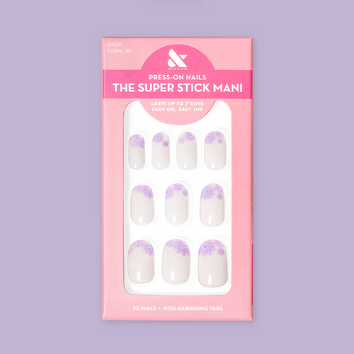 Floral Tip | Short | Round - Tab Press-On nails with neutral base and lavender flower tips in retail pink packaging