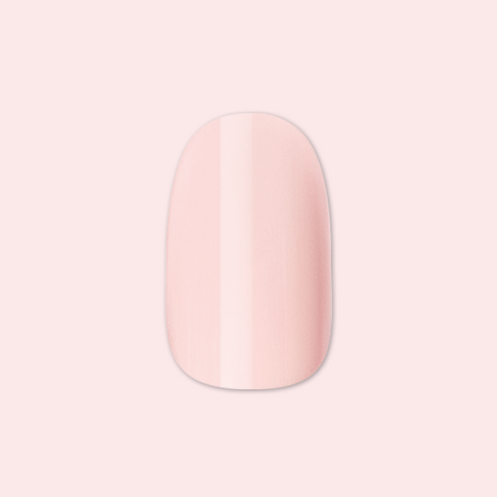 Gelato | Short | Round - Tab Press-On soft baby pink false nail with smooth, glossy finish on pale pink background