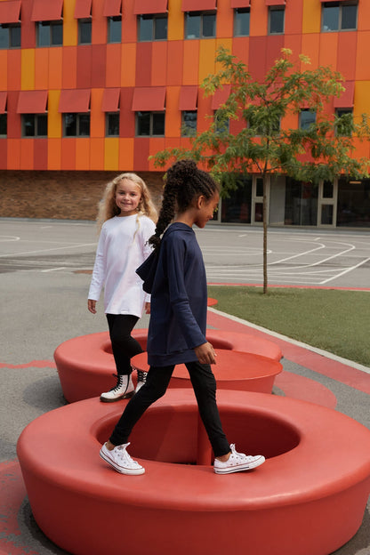 White grow-with-me shirt for toddlers and kids, designed to be worn as a dress, tunic, or long shirt. Seamless shoulders and soft, eco-friendly fabric. Ethically made in Canada.