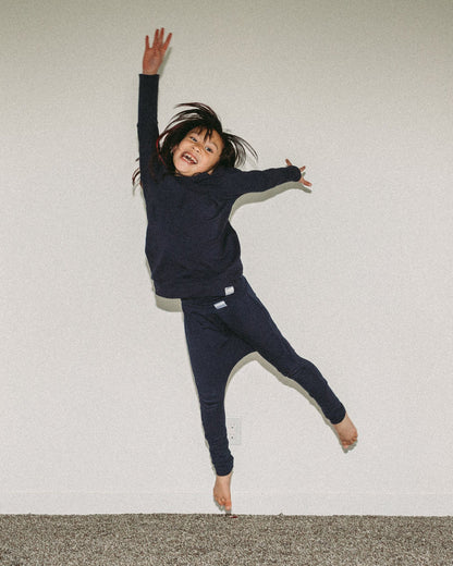 Eco-friendly kids' clothing – gender-neutral Navy grow with me sweater, sustainably made in Canada.