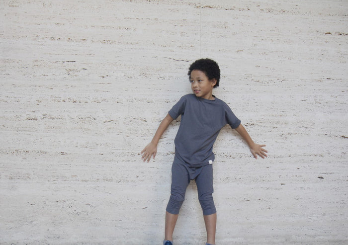 Dark Grey grow-with-me t-shirt for kids, made from soft Lyocell. Ethically made in Canada for a sustainable and comfy fit.