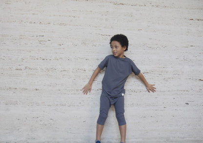 Dark Grey grow-with-me t-shirt for kids, made from soft Lyocell. Ethically made in Canada for a sustainable and comfy fit.