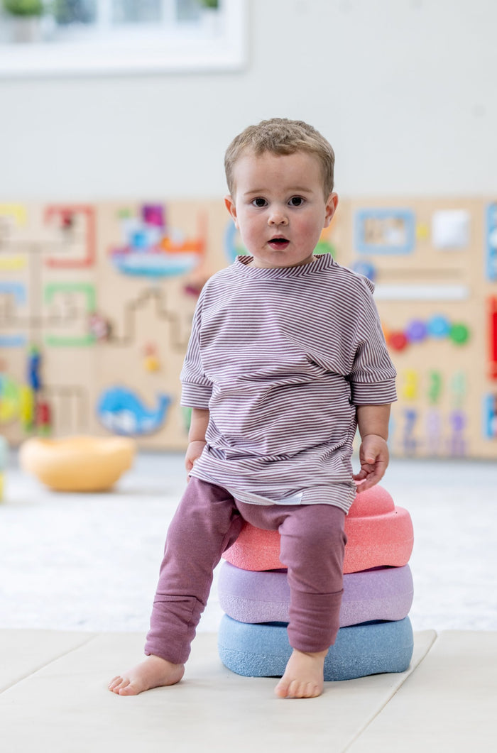 Rose Brown Stripes grow-with-me t-shirt for kids, made from soft organic cotton with a stretchy, foldable waistband. Ethically made in Canada for a sustainable and comfy fit.