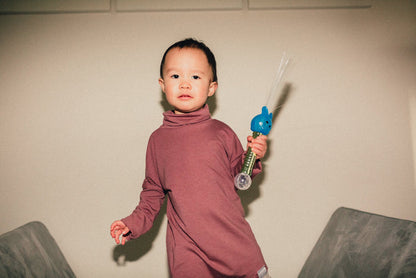 Eco-friendly kids' clothing – gender-neutral Rose Brown grow with me turtleneck, sustainably made in Canada.