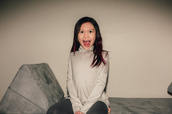 Eco-friendly kids' clothing – gender-neutral Light Grey Taupe grow with me turtleneck, sustainably made in Canada.