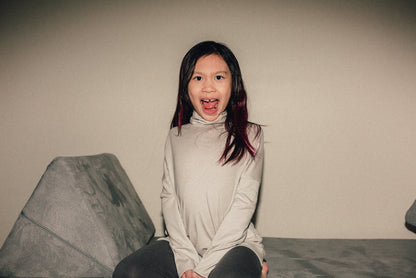 Eco-friendly kids' clothing – gender-neutral Light Grey Taupe grow with me turtleneck, sustainably made in Canada.