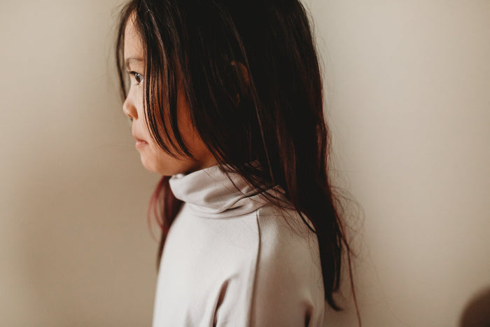 Eco-friendly kids' clothing – gender-neutral Light Grey Taupe grow with me turtleneck, sustainably made in Canada.