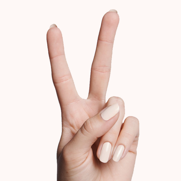 Hand showing nails painted in HGC creamy toasted neutral shade for a warm and natural long-lasting manicure look