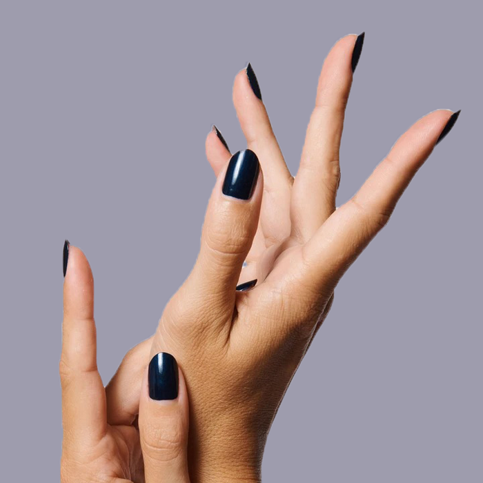 Hands with nails painted in shimmering inky navy using HJ polish showing a sleek, long-lasting manicure