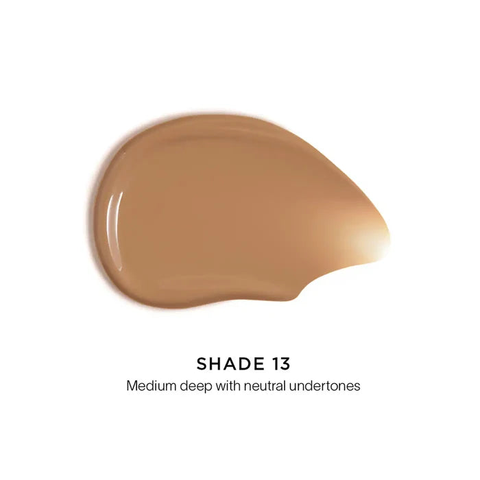 Hourglass Veil Hydrating Skin Tint Foundation Shade 13 NIB, close-up of sleek bottle with product label and applicator.
