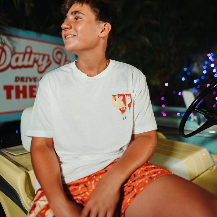 Youth model wearing white Ice Cream Cherry youth graphic tee
