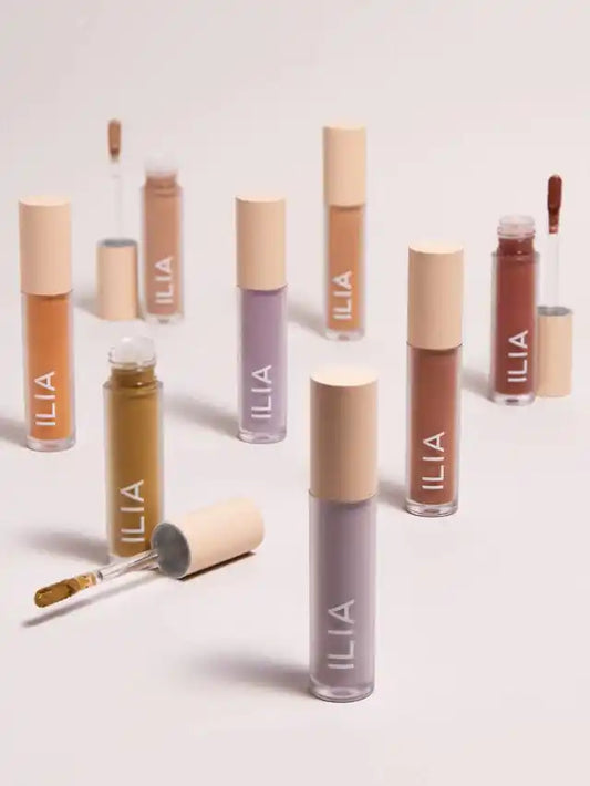 Ilia Liquid Powder Eye Tint in matte and chromatic shades, new in box, showcasing vibrant eye makeup in multiple colors.