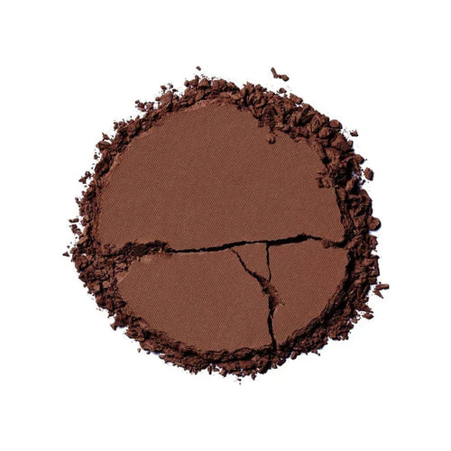 Ilia Nightlite Bronzing Powder in Songbird, a compact beauty product with warm bronze tones and subtle shimmer.