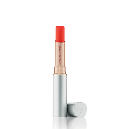 A single stick of Just Kissed Lip and Cheek Stain in color "Forever Red", presented with its cap removed, against a white background.