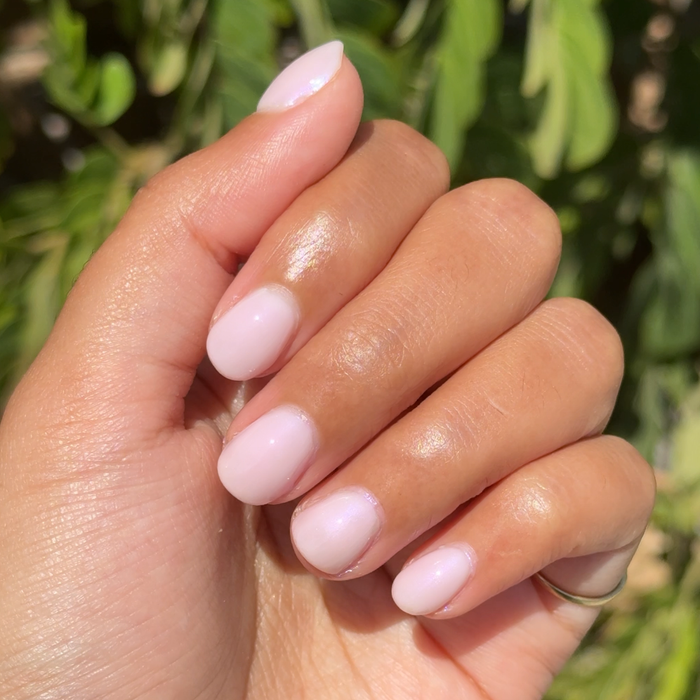 Kiss of Chrome quick dry polish with pearly sheer finish on natural nails for a glossy at-home manicure