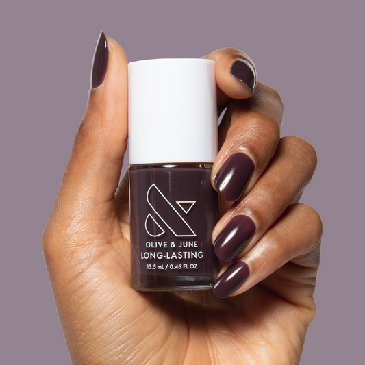 Let's Stay In gel polish on nails showing ultra dark maroon-brown for a cozy, long-lasting at-home manicure by Olive and June