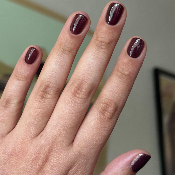 Let's Stay In gel polish on short nails showing deep maroon-brown for a cozy, long-lasting manicure by Olive and June
