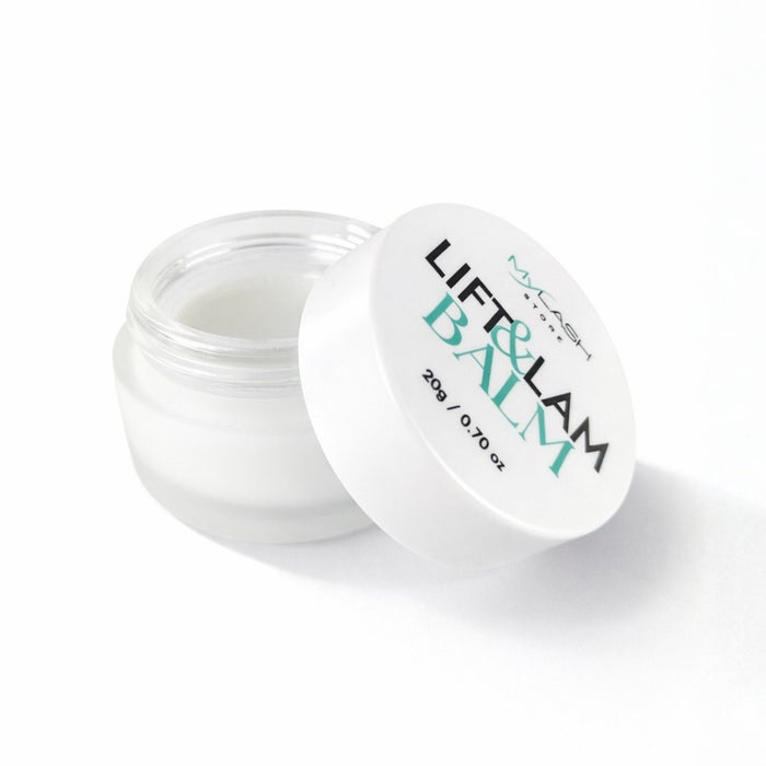 Open jar of Lift & Balm on a white background