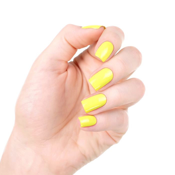 Limoncello vibrant yellow nail polish manicure on a light skin tone