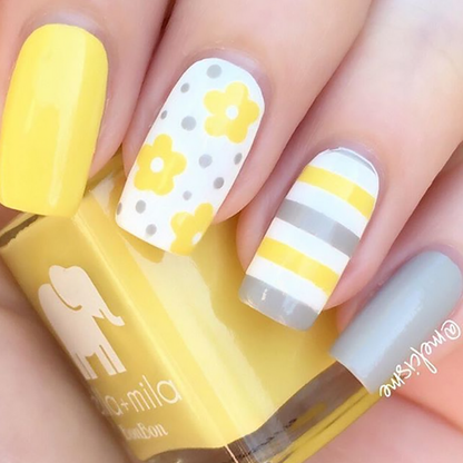 Limoncello yellow nail polish with white daisy and stripe accent nail art