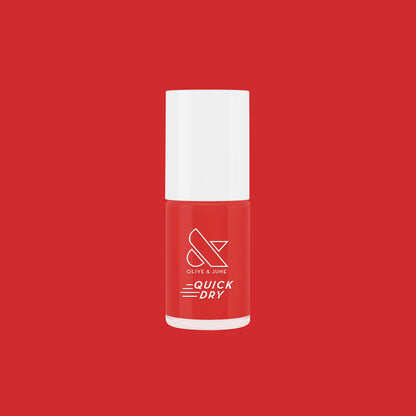 Olive and June Lippy quick dry nail polish bottle in bold glossy red shimmer on matching red background