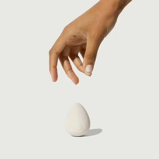 Maude Drop Body Massager from maude, a sleek pleasure device with smooth curves, designed for intimate massage and comfort.