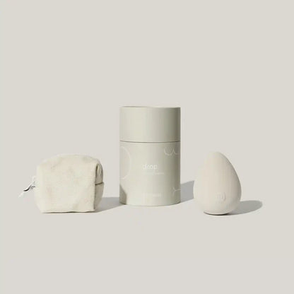 Maude Drop Body Massager, a sleek pleasure device with smooth design, shown in a modern, minimalist setting.