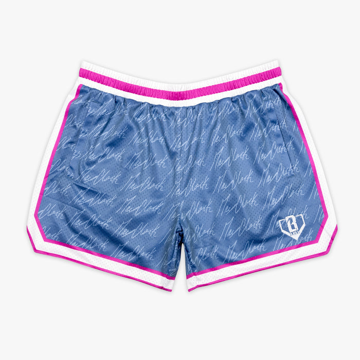 Adult model wearing shorts with “Max Clark Signature” design