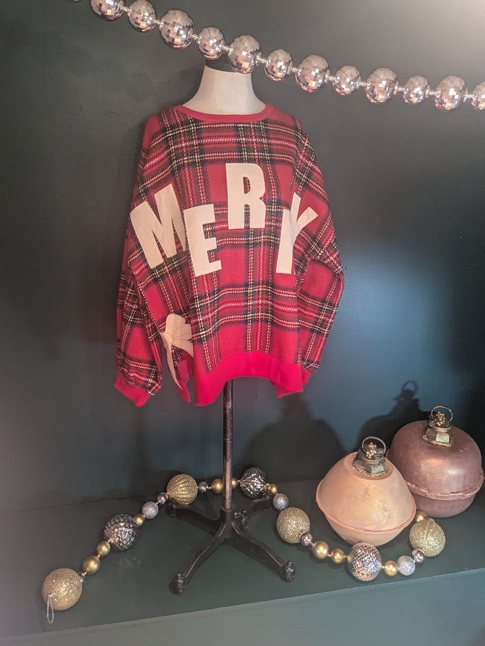 BiBi Merry Bow Sweatshirt featuring festive holiday design in soft fabric, perfect for cozy winter wear.