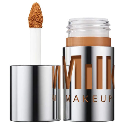 Milk Makeup Future Fluid concealer in 22NW NIB, medium coverage, hydrating formula, displayed in a sleek beige tube.