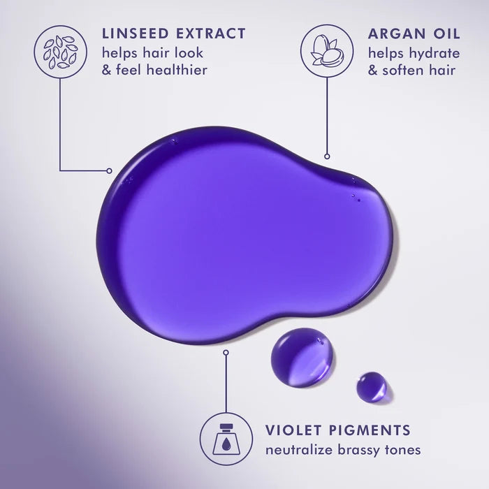 Moroccanoil Treatment purple hair oil for blonde hair in 50ml bottle, displayed with a focus on the product and packaging.