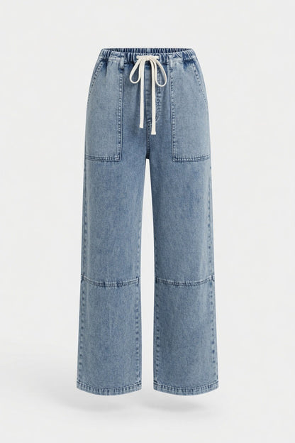 Light blue wide-leg denim pants with a drawstring waist and front patch pockets, shown on a plain light gray background.