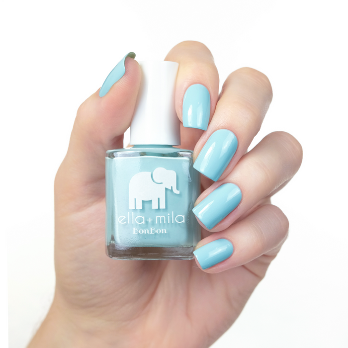 My Baby Blue pastel blue nail polish manicure on a light skin tone with the bottle