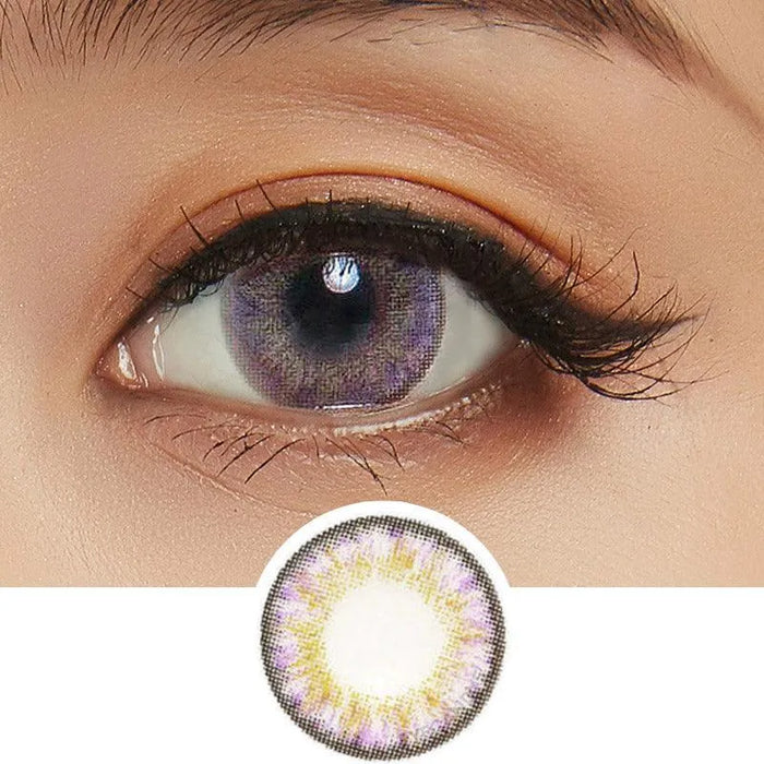Close-up of an eye with long lashes wearing NEO Vision Cosmo Violet circle lenses by NEO Vision, featuring a purple and yellow patterned design. Below is an enlarged image highlighting the lens' vivid colors and unique pattern.