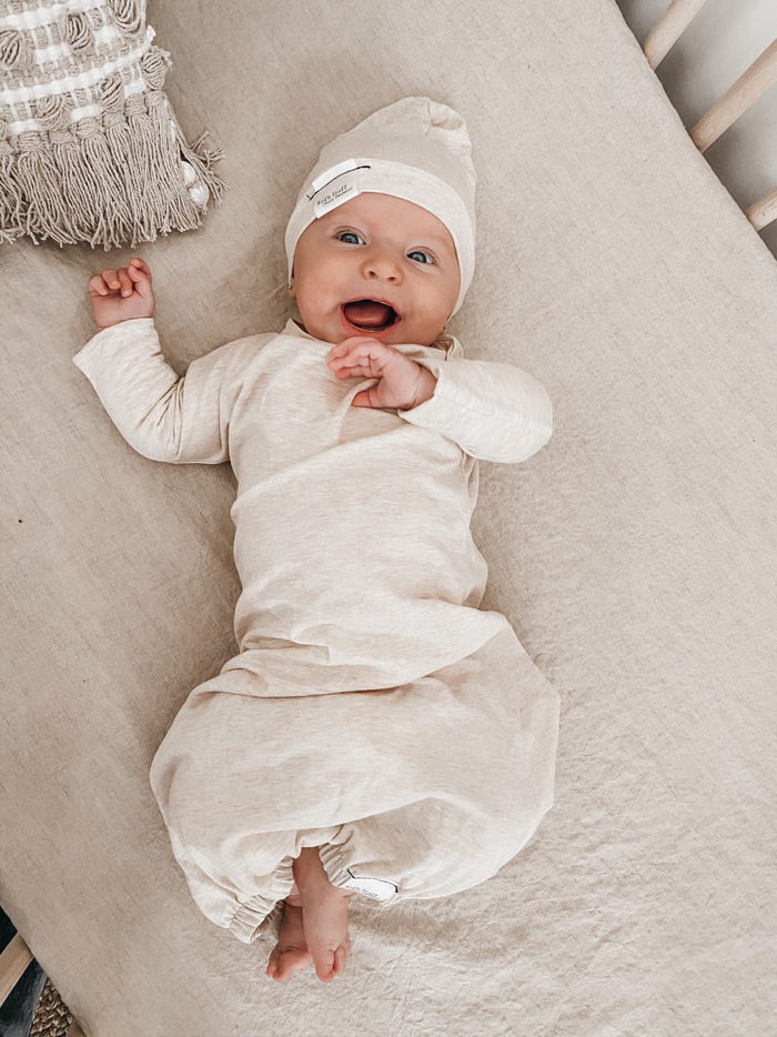 Eco-friendly kids' clothing – gender-neutral heather cream newborn gown, sustainably made in Canada.