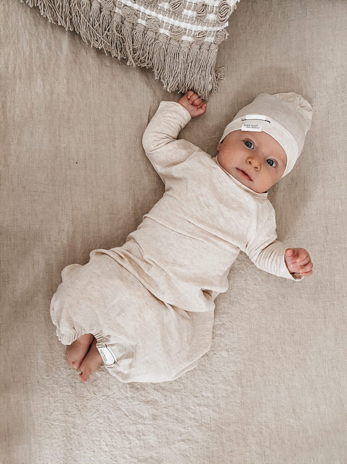 Eco-friendly kids' clothing – gender-neutral heather cream newborn gown, sustainably made in Canada.
