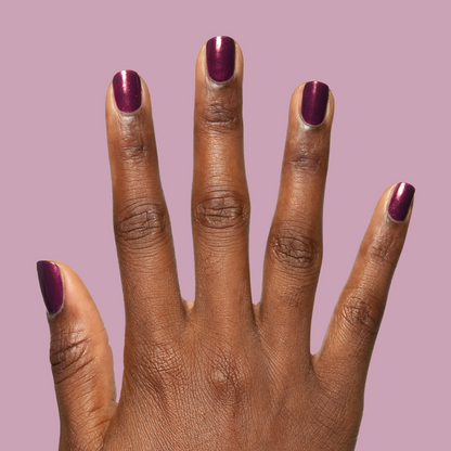 On the Promenade shimmering mulberry purple polish on nails for a vibrant, long-lasting at-home manicure look