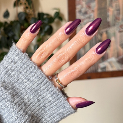 On the Promenade shimmering mulberry purple gel polish on nails for an elegant long-lasting at home manicure look