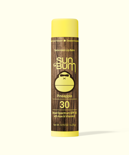 Sun Bum Pineapple sunscreen lip balm on a white background