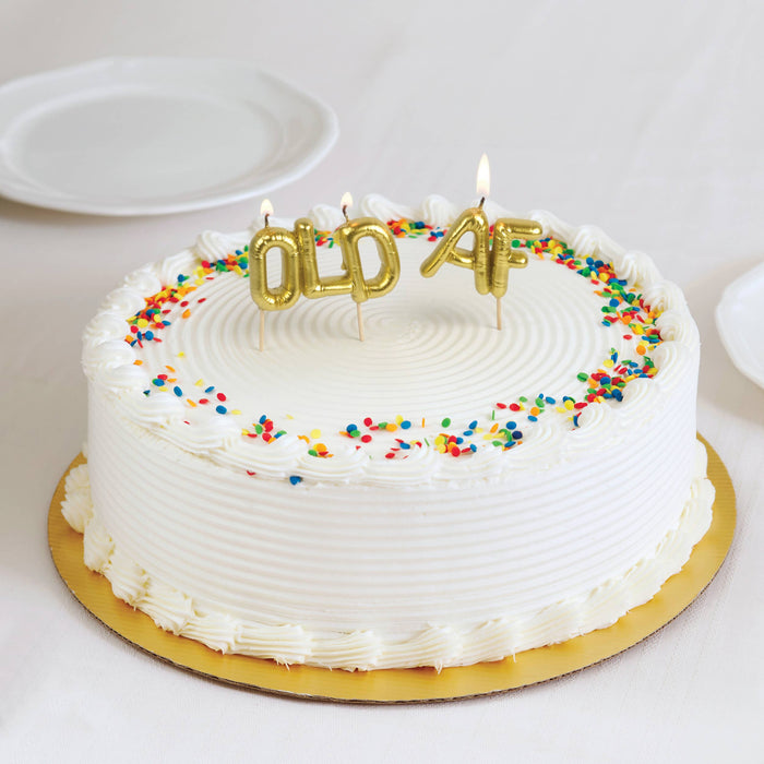 Set of Fred & Friends Old AF party candles with humorous design, featuring colorful wax and playful lettering.