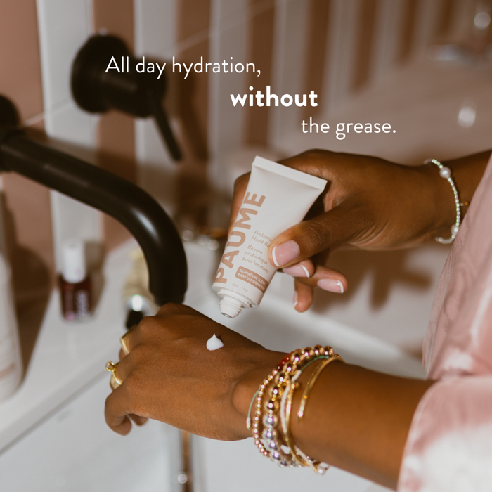 PAUME Probiotic Hand Balm in a tube, featuring a sleek design and creamy texture for nourishing and moisturizing hands.