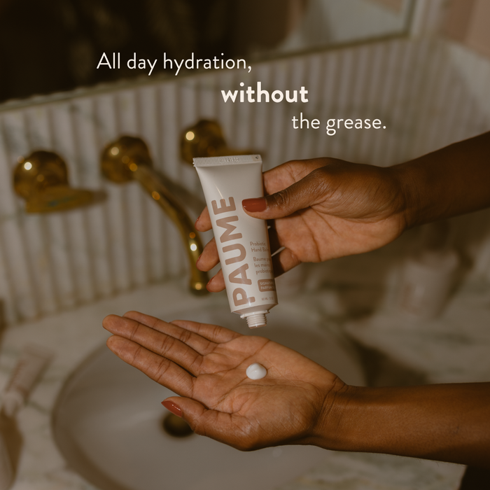 PAUME Probiotic Hand Balm jar with cream visible, highlighting its smooth, nourishing texture and minimalist packaging design.