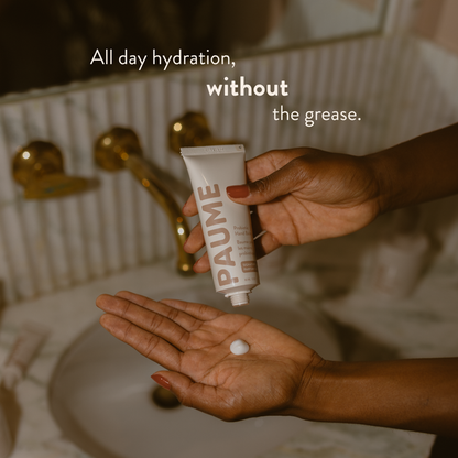 PAUME Probiotic Hand Balm jar with cream visible, highlighting its smooth, nourishing texture and minimalist packaging design.