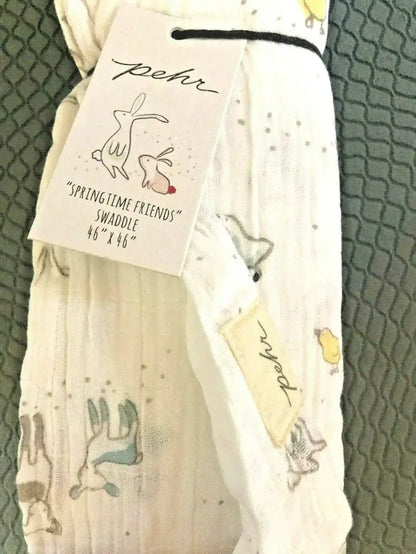 Pehr Springtime Friends baby swaddle blanket, 46x46 inches, featuring colorful spring-themed patterns on soft fabric.