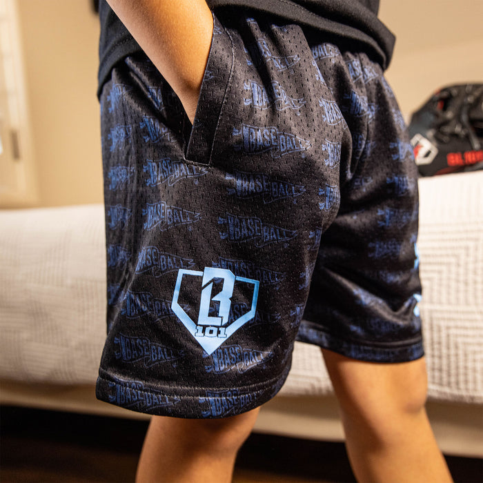 Youth model wearing black and light blue Pennant youth shorts