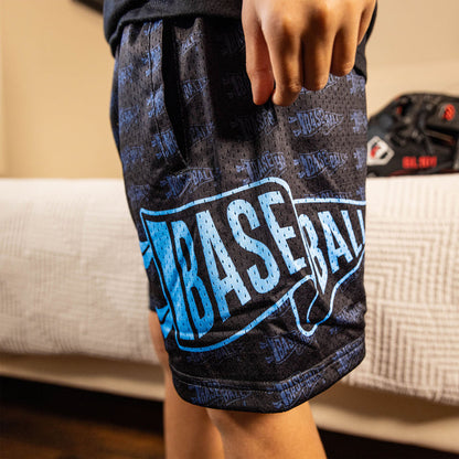 Youth model wearing black and light blue Pennant youth shorts