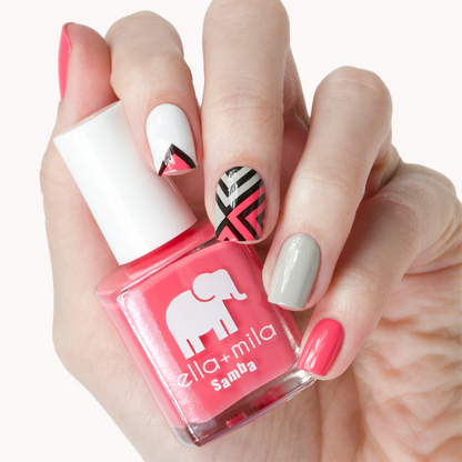 Pinktini coral pink nail polish with grey, black and white striped accent nails