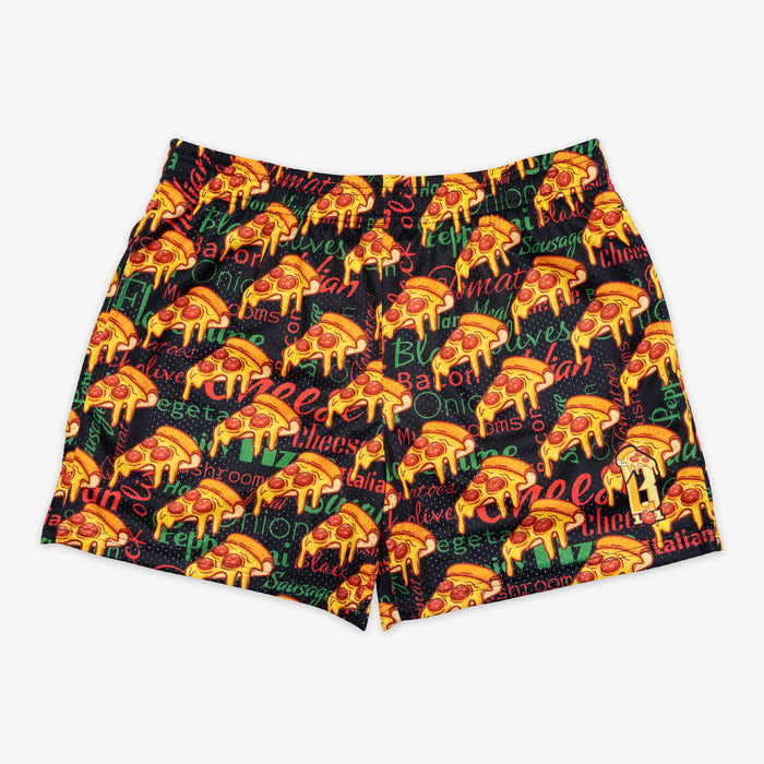 Youth model wearing multi-color youth shorts with “Pizza” design