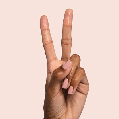 Hand showing softly manicured nails painted in Poodle for a refined and easy at-home manicure look